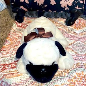 Dog plush with bow